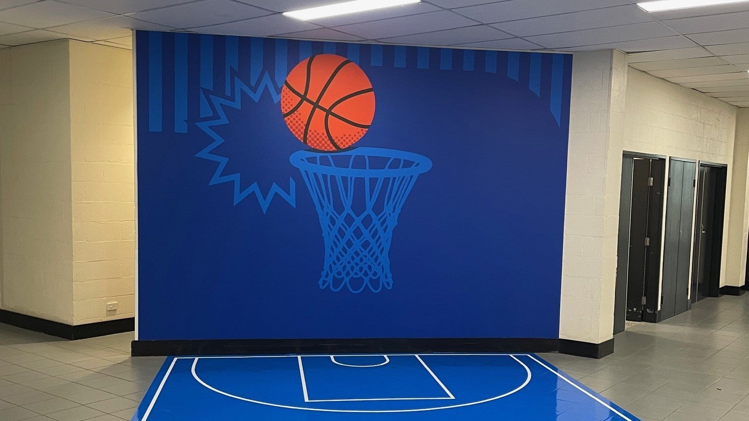 School basketball sign on wall and floor