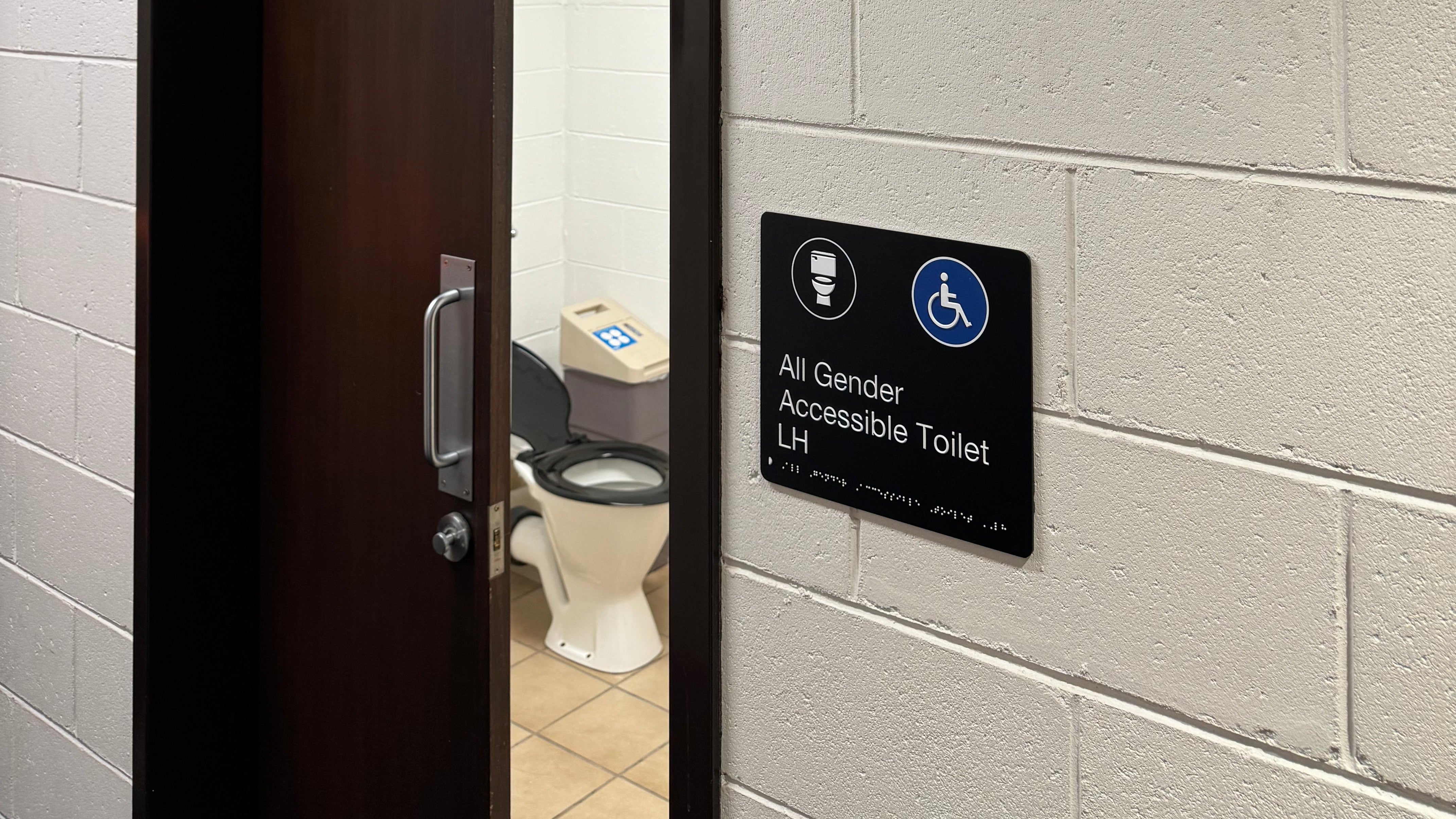 School accessible toilet signs with braille
