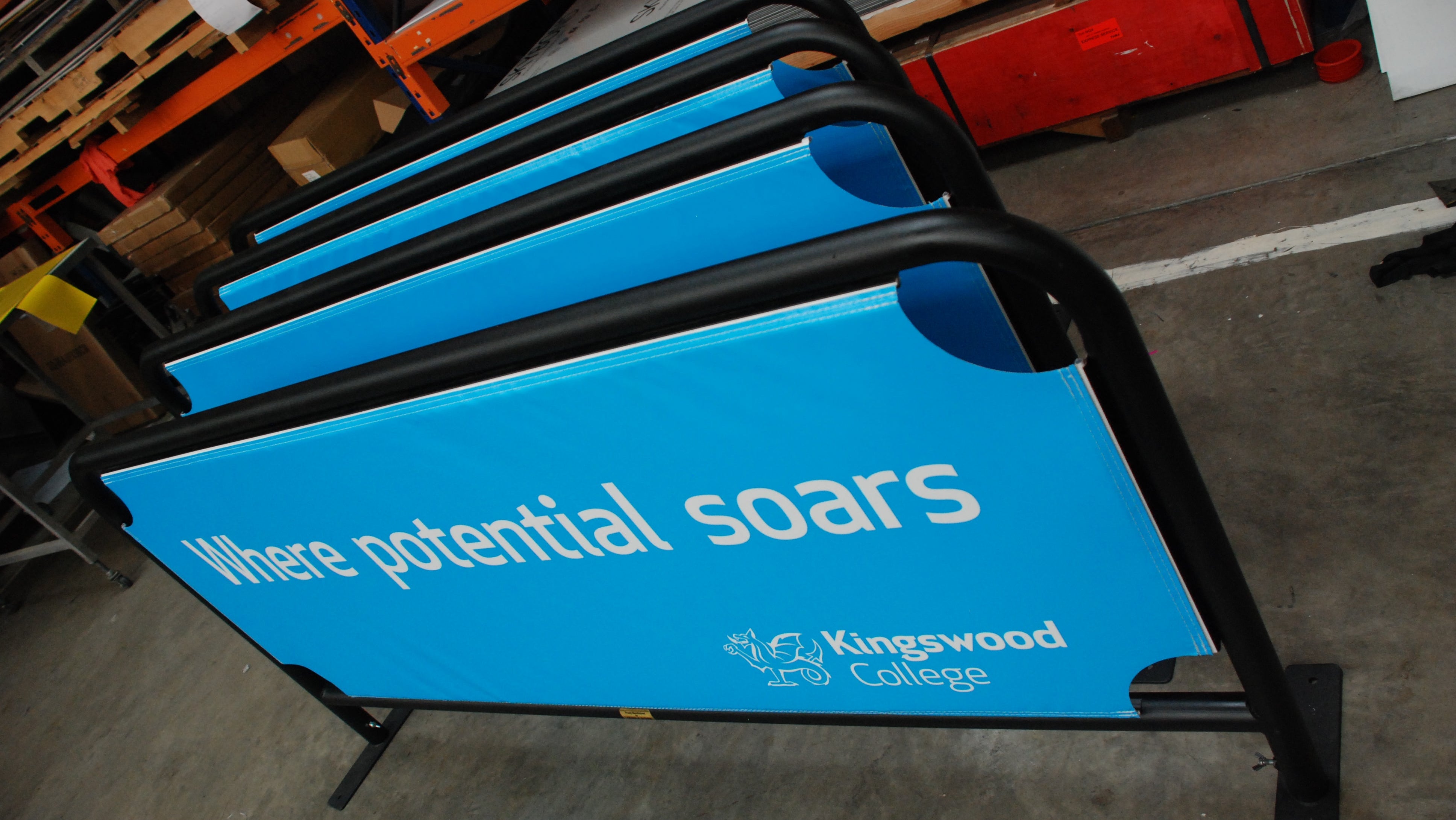 Temporary barrier signs for Kingswood College.